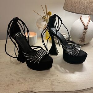 Jennifer Lopez Black Heels with Silver Straps